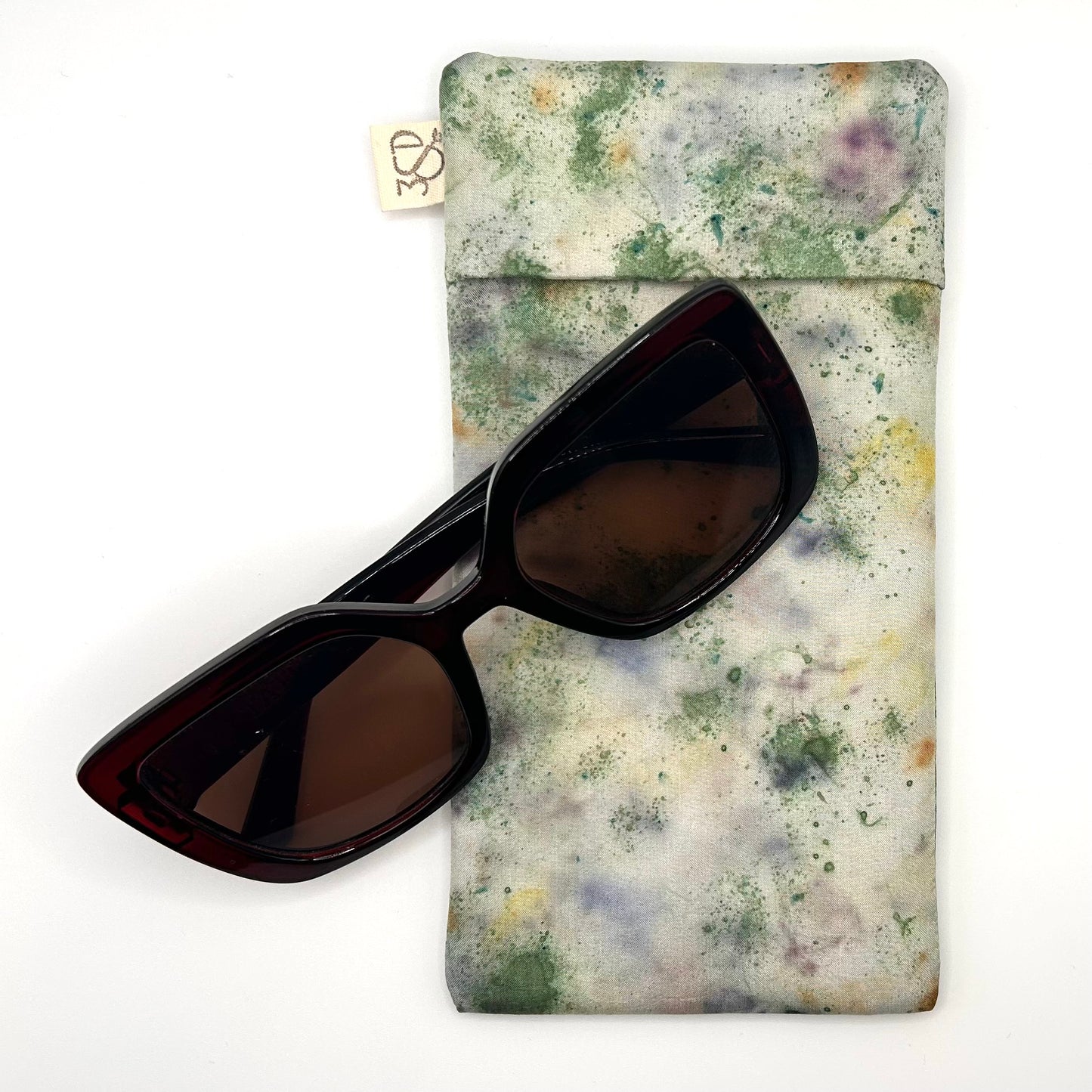 Green Garden Glasses Case naturally dyed silk, printed with Pansy petals and extract dye, displayed with Sunglasses
