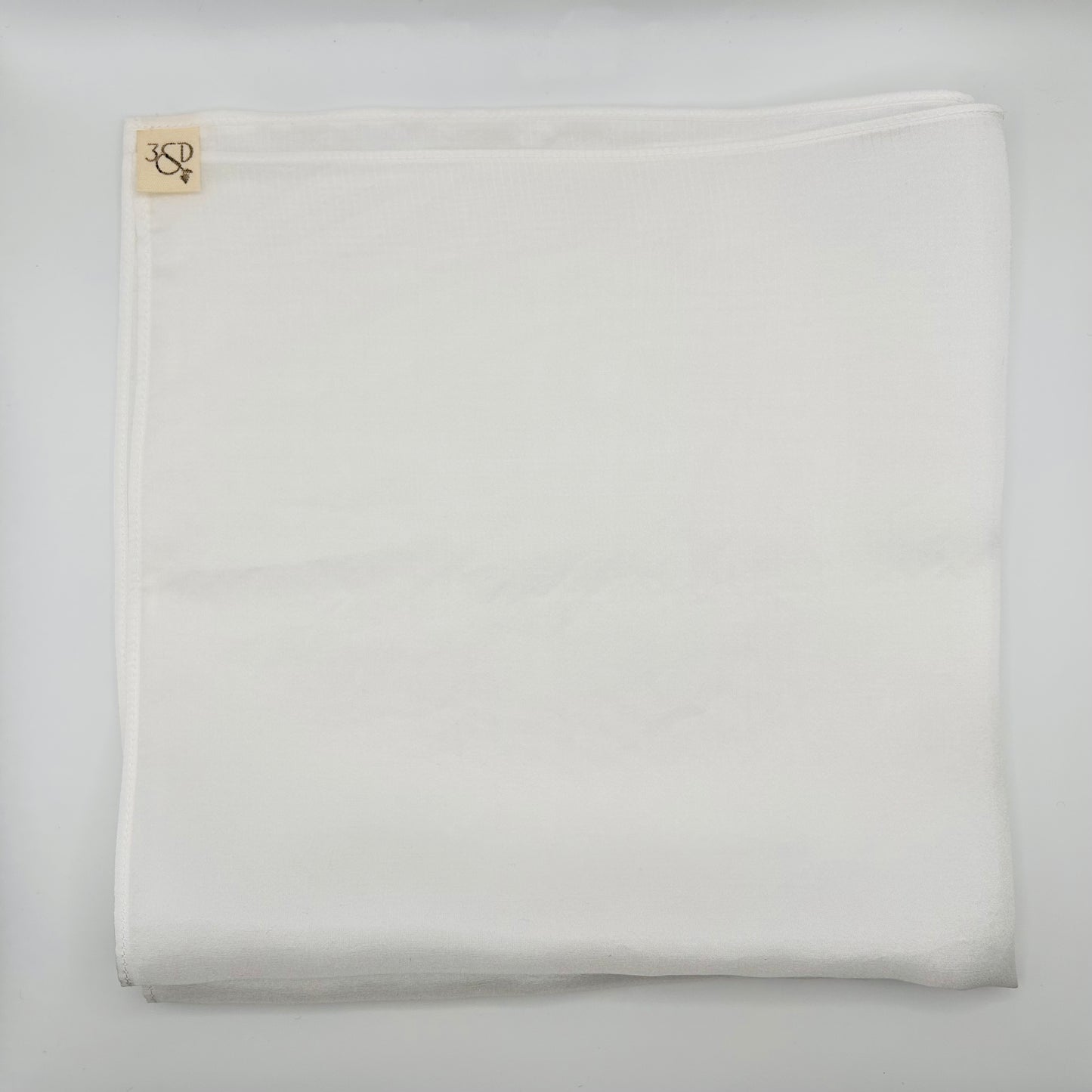 White silk wedding pocket square with branded cotton tab, prepare to naturally dye folded into a square