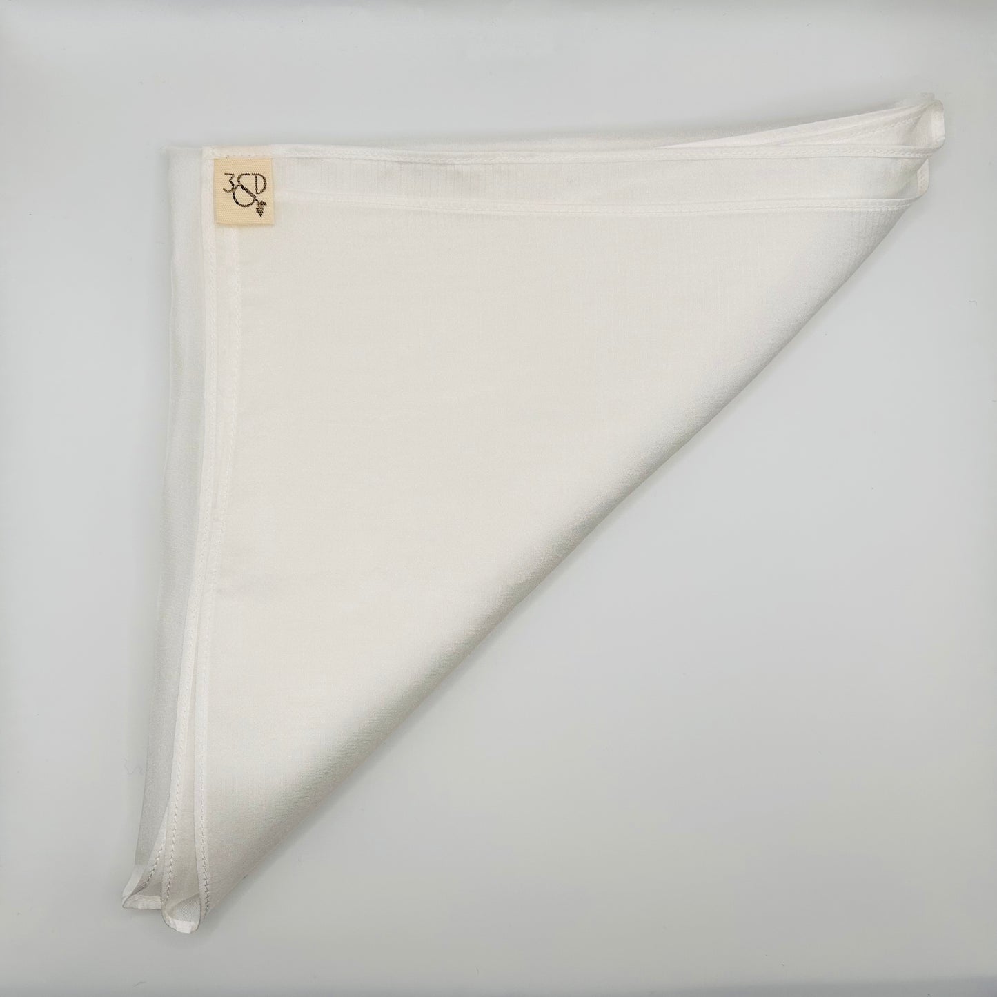 White silk wedding pocket square with branded cotton tab, prepare to naturally dye folded into a triangle