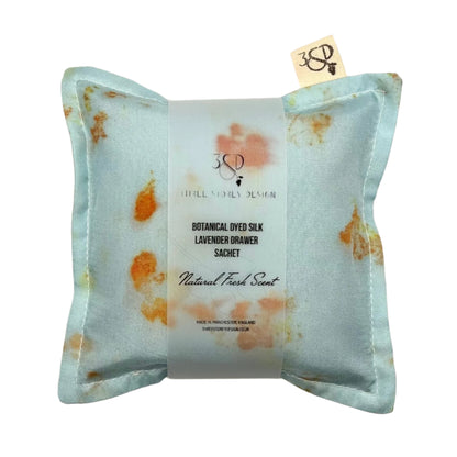 Pale indigo Silk square lavender bag/sachet with Naturally dyed orange cosmos print and cotton branded tab, wrapped in tracing paper product information sleeve