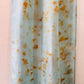 Pale indigo long silk scarf with orange cosmos naturally dyed print close up of pattern 