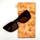 Pale Orange Glasses Case front naturally dyed silk, printed with Orange cosmos, coreopsis and extract dye , displayed with sunglasses