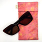 Pink floral Glasses Case front naturally dyed silk, printed  with yellow marigolds and extract dye , displayed with sunglasses