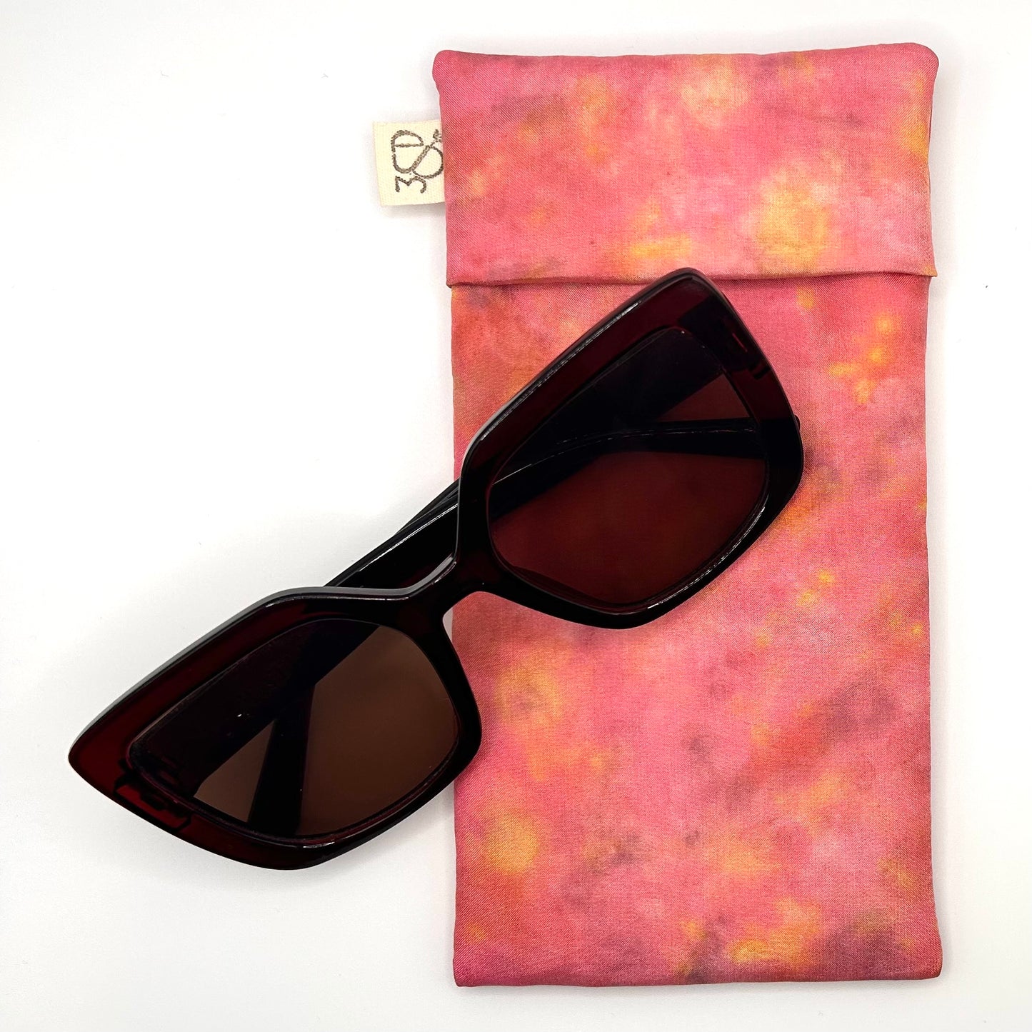 Pink floral Glasses Case front naturally dyed silk, printed  with yellow marigolds and extract dye , displayed with sunglasses