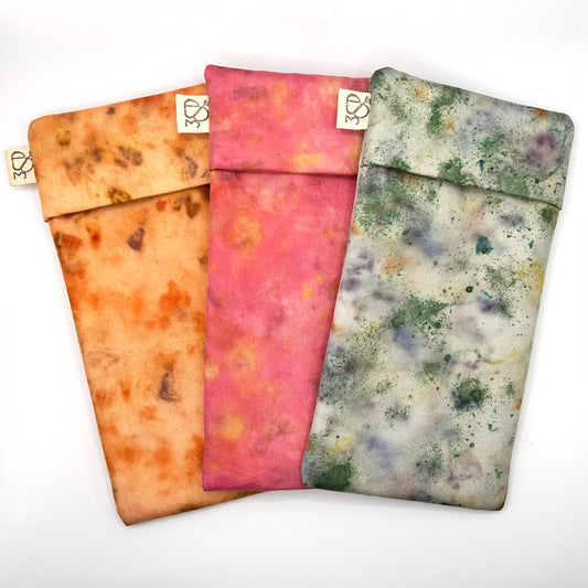 3 Naturallly dyed Silk Glasses Cases, displayed in a fan , pale orange, Pink Floral and Green Garden colours