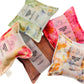 Various Silk Square lavender sachets all colourways displayed in a pile
