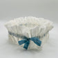  Open front view of White Silk wedding garter with adjustable Indigo blue tied bow, ready for natually dyeing