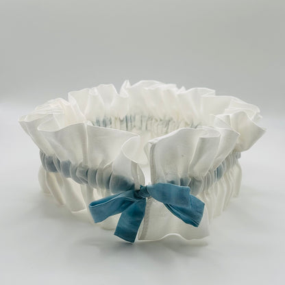  Open front view of White Silk wedding garter with adjustable Indigo blue tied bow, ready for natually dyeing
