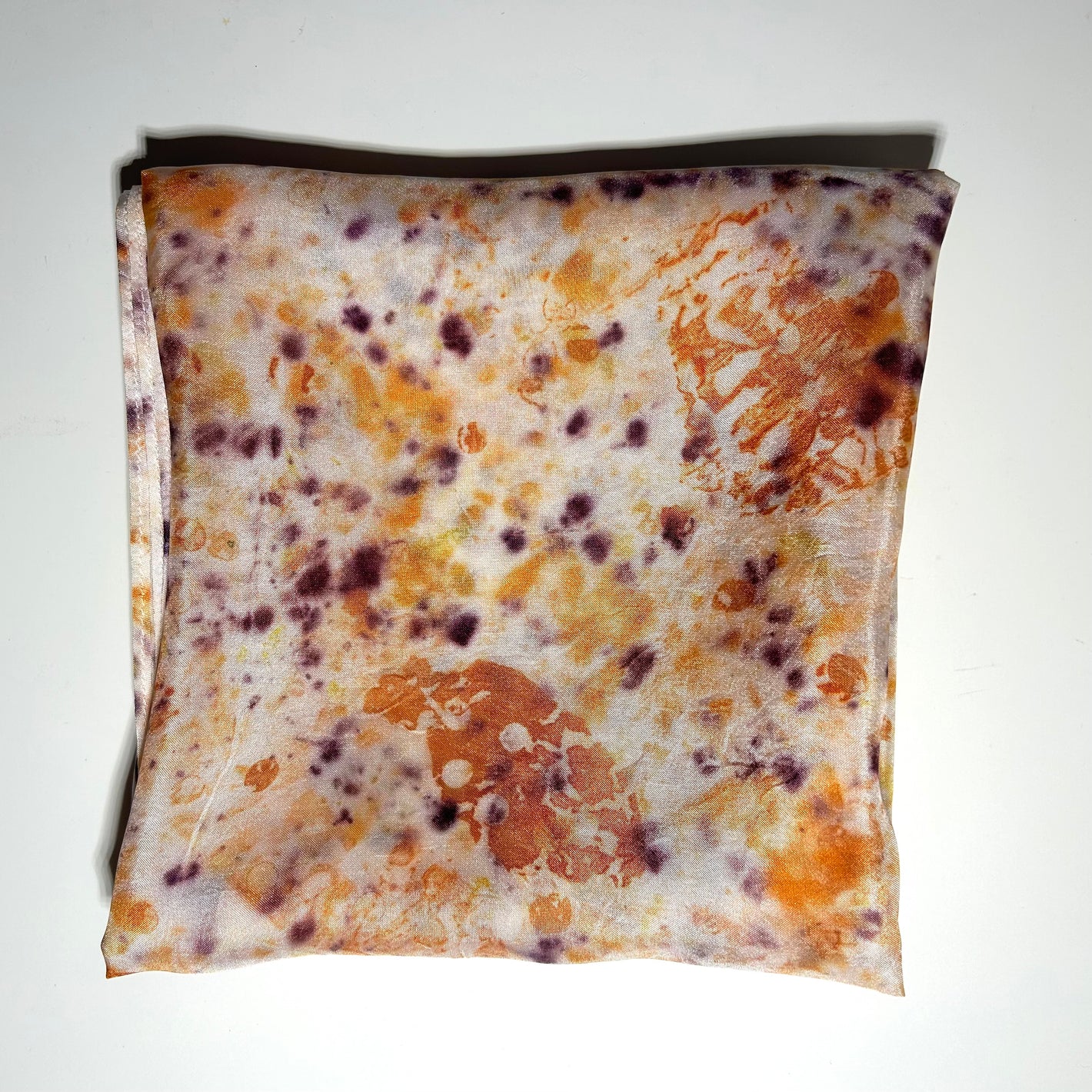 White and camel onion naturally dyed  silk square scarf  folded into a square